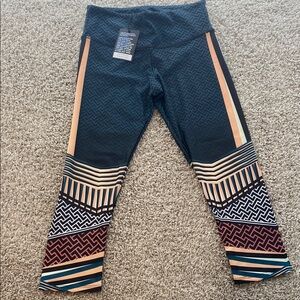 Onzie graphic Capri leggings. BNWT. 3 pair left.